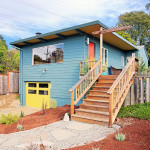 May2015-Trulia-10-High-Impact-Home-Improvements-You-Can-Do-For-Under-10K-or-Less-new-blue-home-with-yellow-door