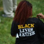 “The Cloak I Was Offering Them Was Identification With My Whiteness” 483504336-woman-wears-a-shirt-with-black-lives-matter-during-a.jpg.CROP_.rtstoryvar-large
